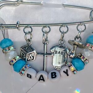 Silver Baby Charm Brooch with Blue Beads